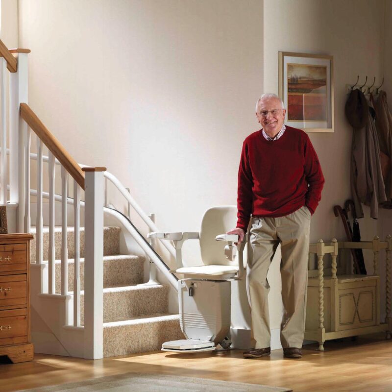 main standing beside stairlift