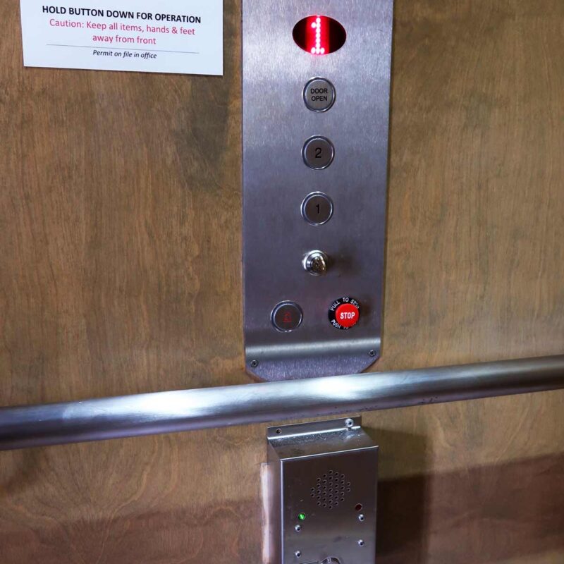 close up of elevator buttons