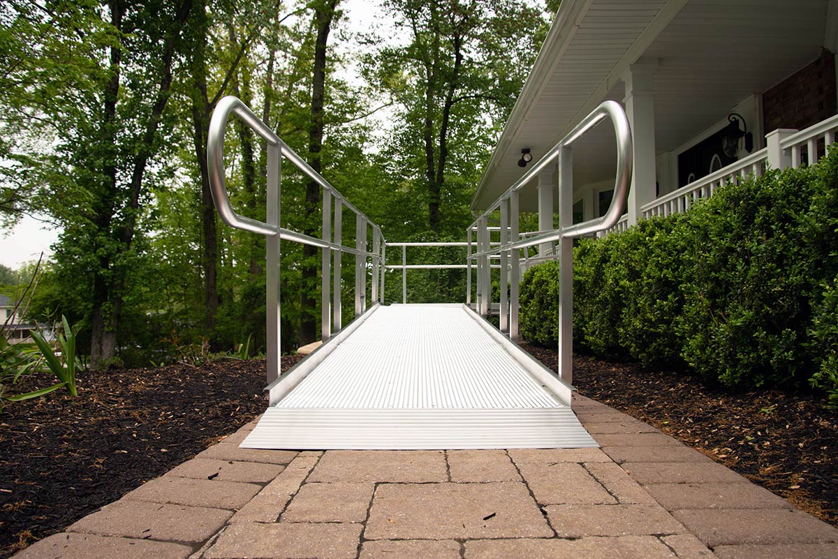 home exterior with wheelchair ramp in white
