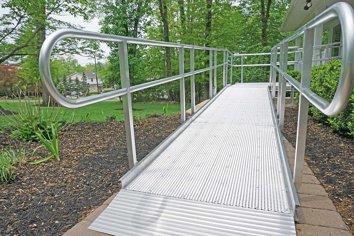 home exterior with wheelchair ramp in white