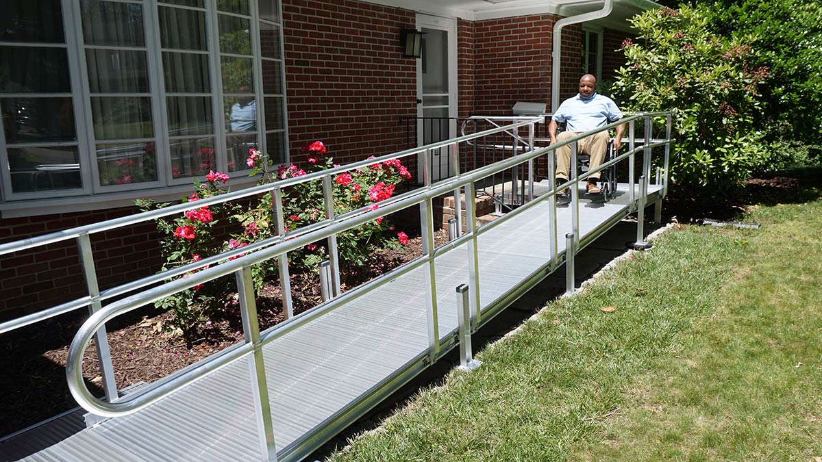 home exterior with wheelchair ramp in white