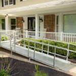 home exterior with wheelchair ramp in white