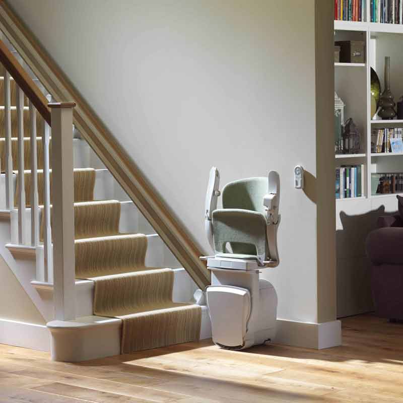 stationary stairlift with seat folded up, unused